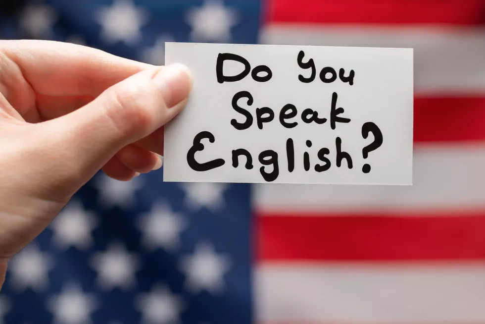 you-speak-english-text-card-american-flag-background