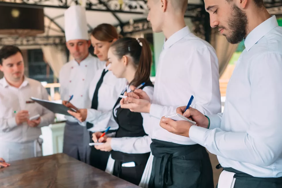 restaurant-manager-his-staff-terrace-interacting-head-chef-restaurant(1)