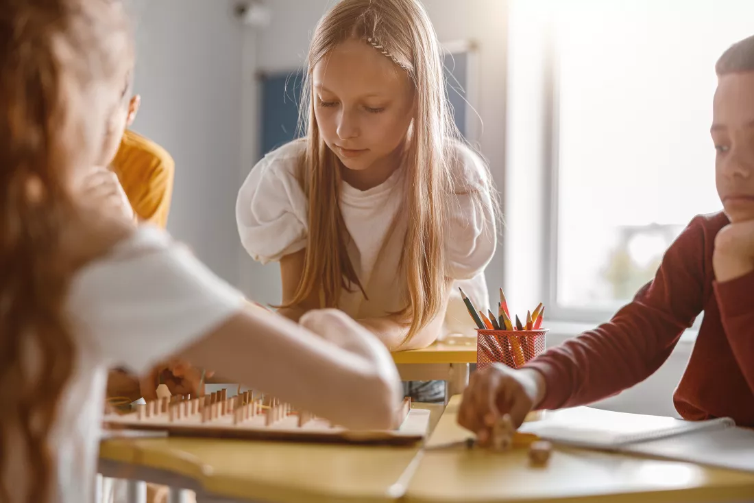 kids-using-geoboard-together-classroom-school