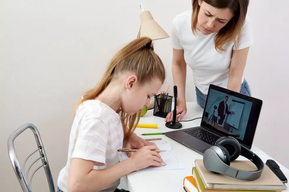 mother-helping-daughter-with-homework