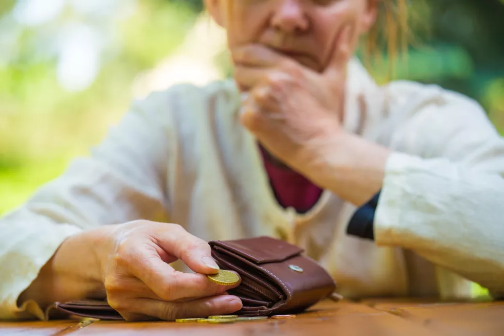 midsection-woman-holding-coins