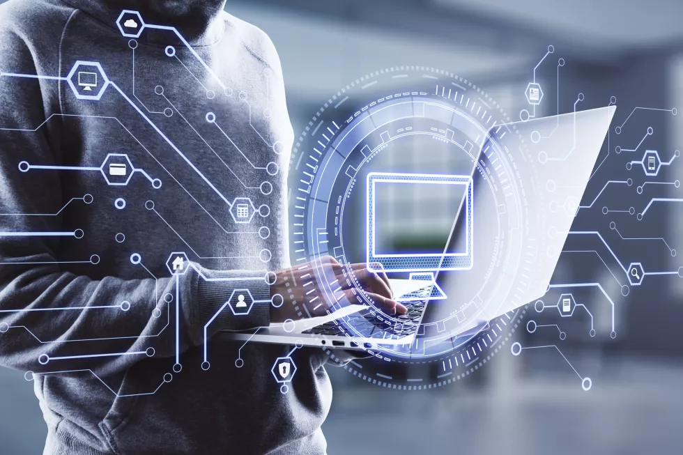 hacker-using-laptop-with-creative-computer-icon-hologram-blurry-office-background-digital-transformation-fraud-concept-double-exposure