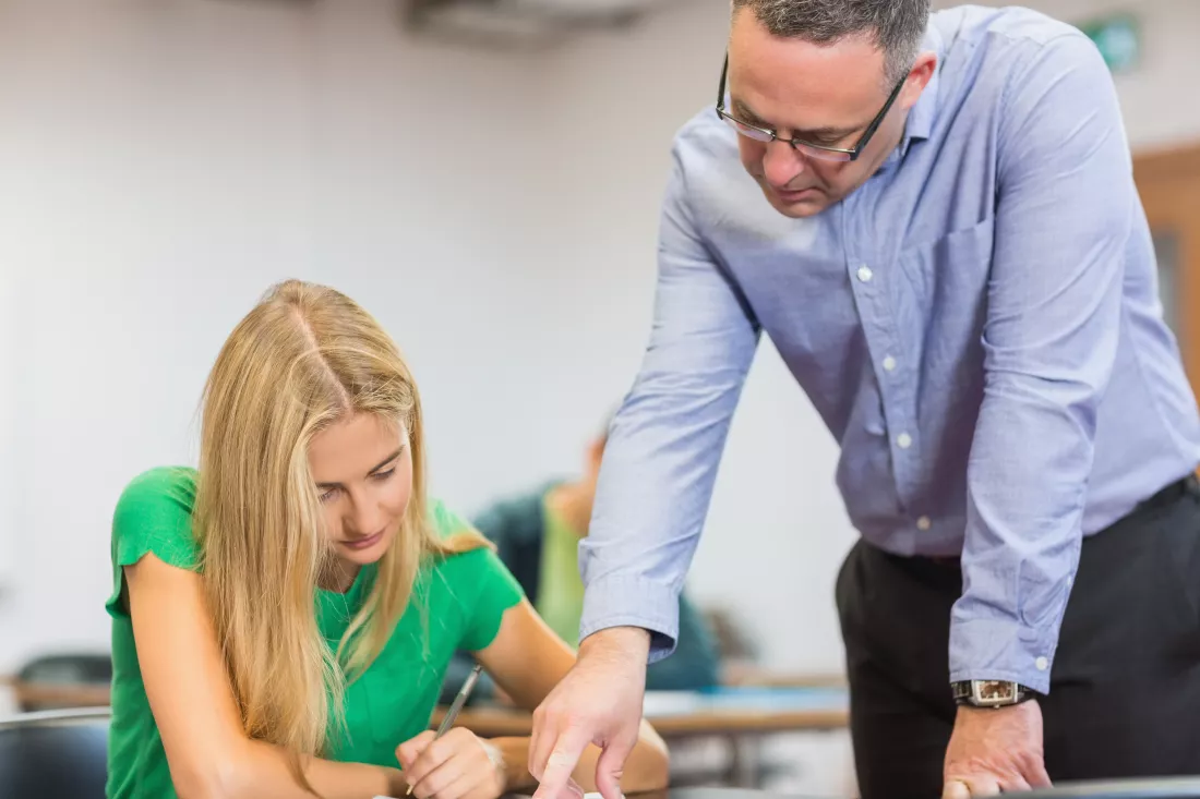 teacher-with-student-classroom