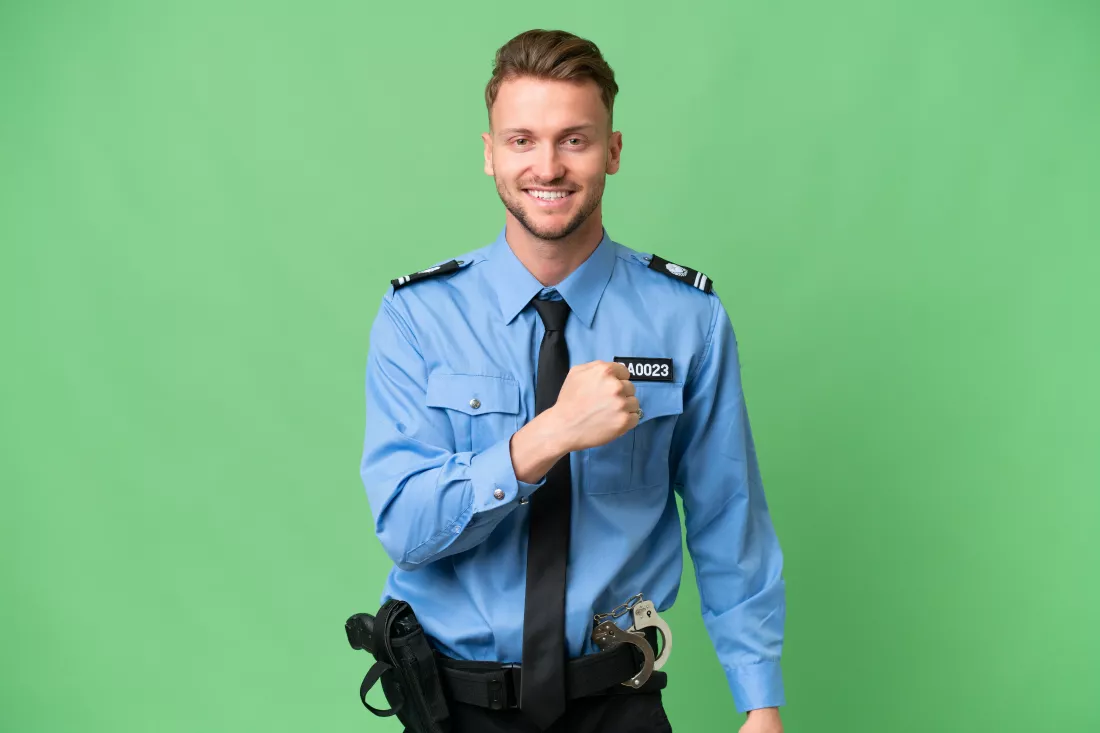 young-police-man-isolated-background-celebrating-victory