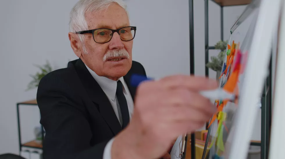 portrait-businessman-using-mobile-phone