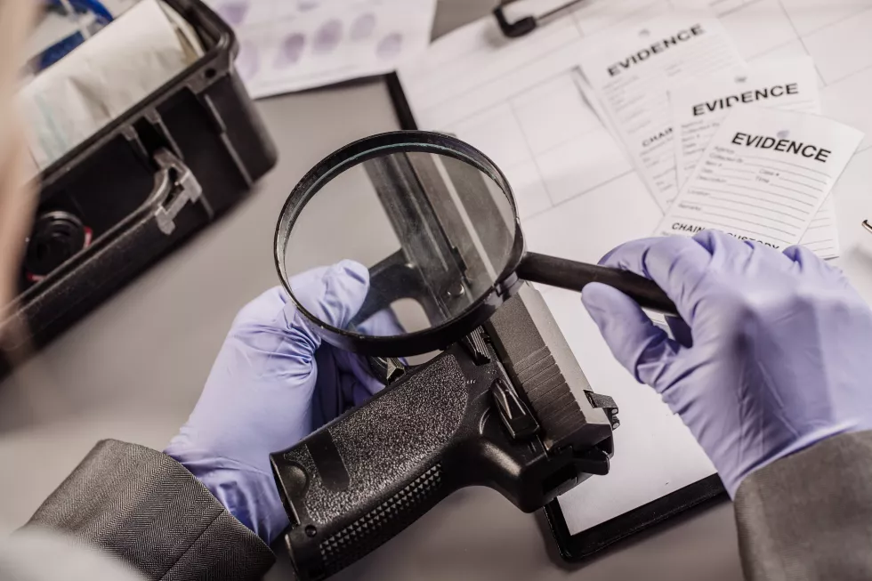 detective-through-magnifying-glass-looking-evidence
