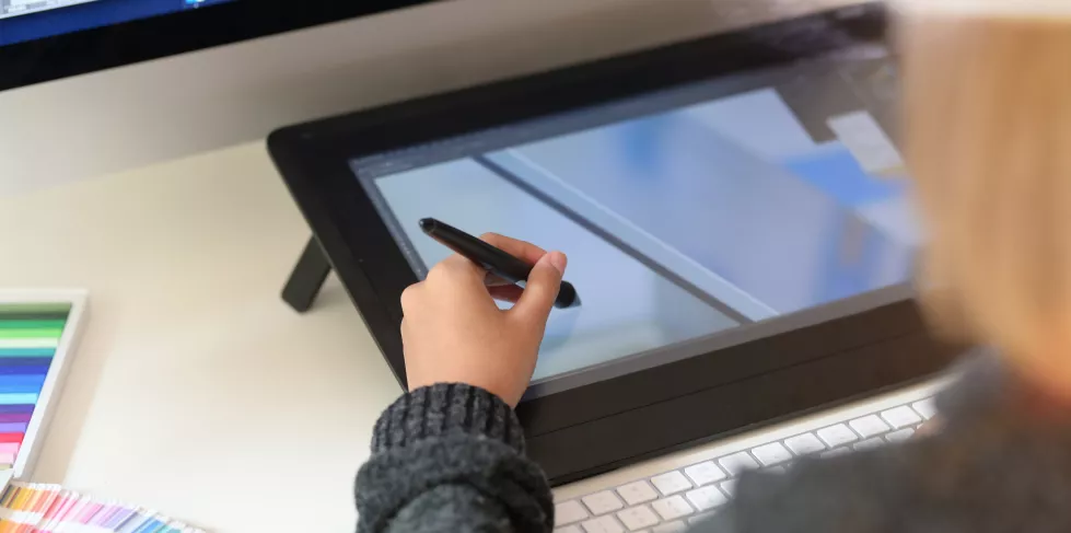 young-designer-drawing-sketches-graphic-tablet