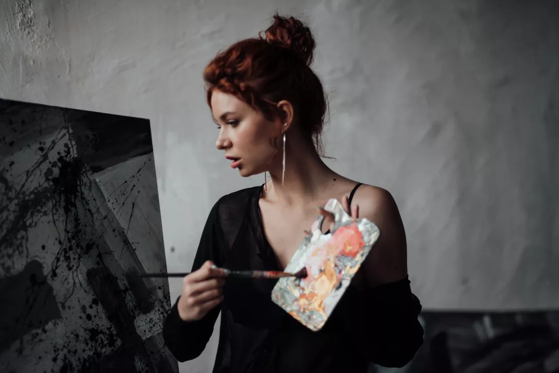 young-woman-looking-away-against-wall