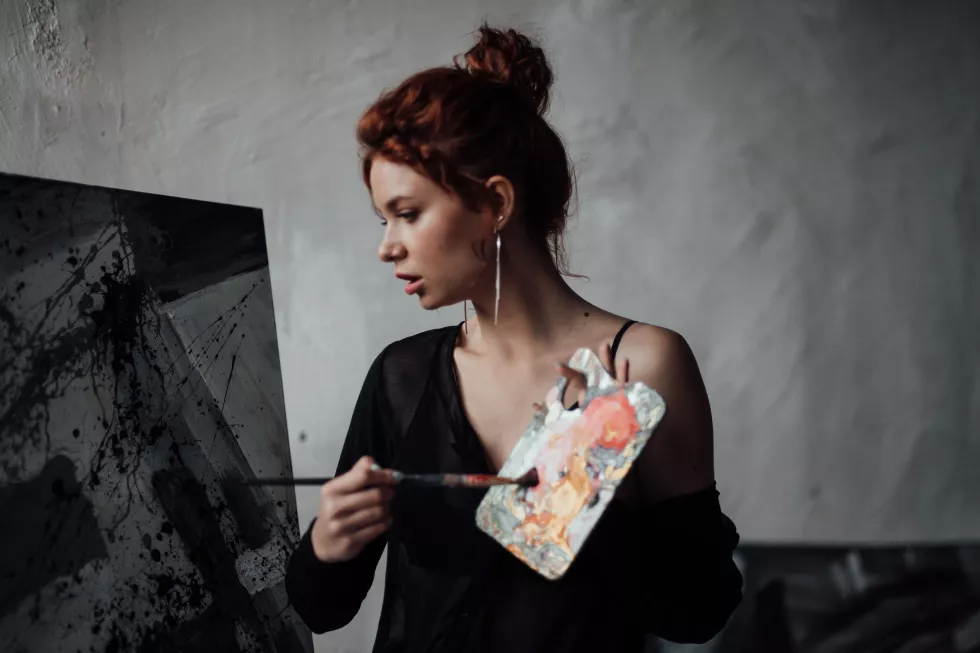 young-woman-looking-away-against-wall