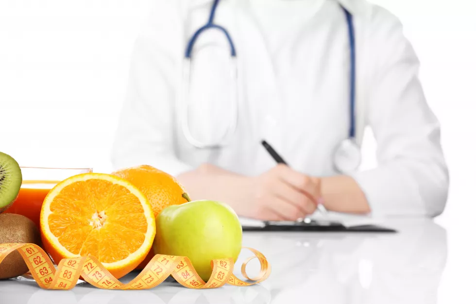 nutritionist-doctor-writing-diet-plan-isolated-white