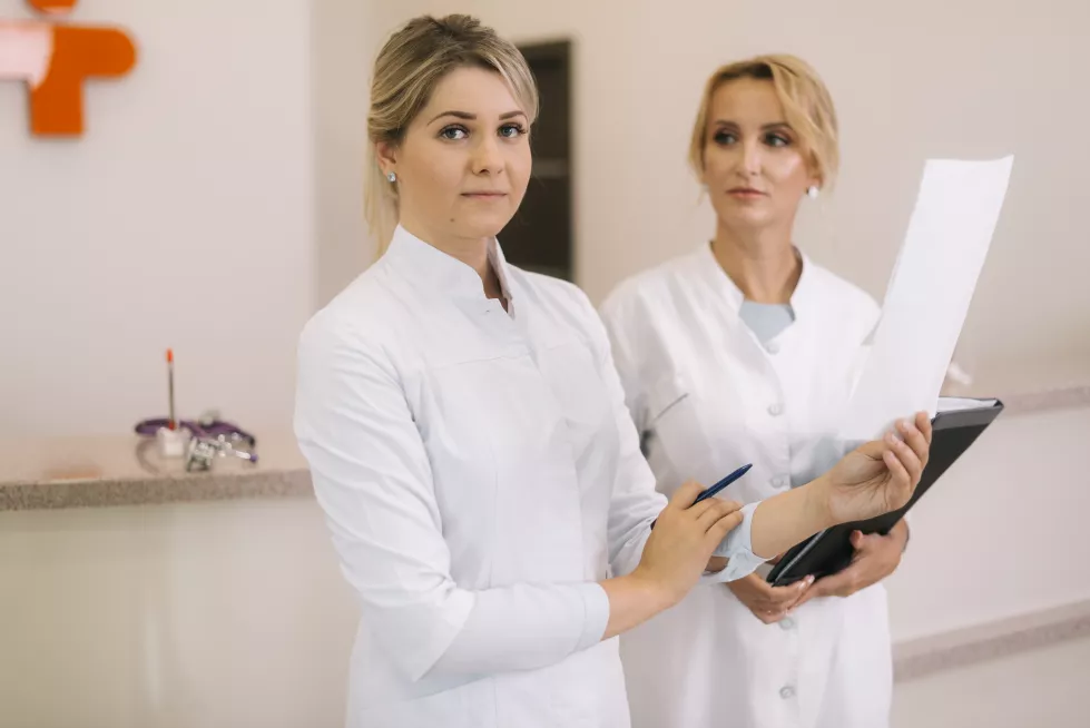portrait-smiling-doctor-nurse-looking-camera