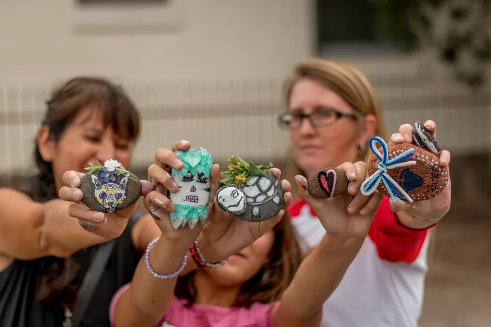 women-with-girl-holding-decorations
