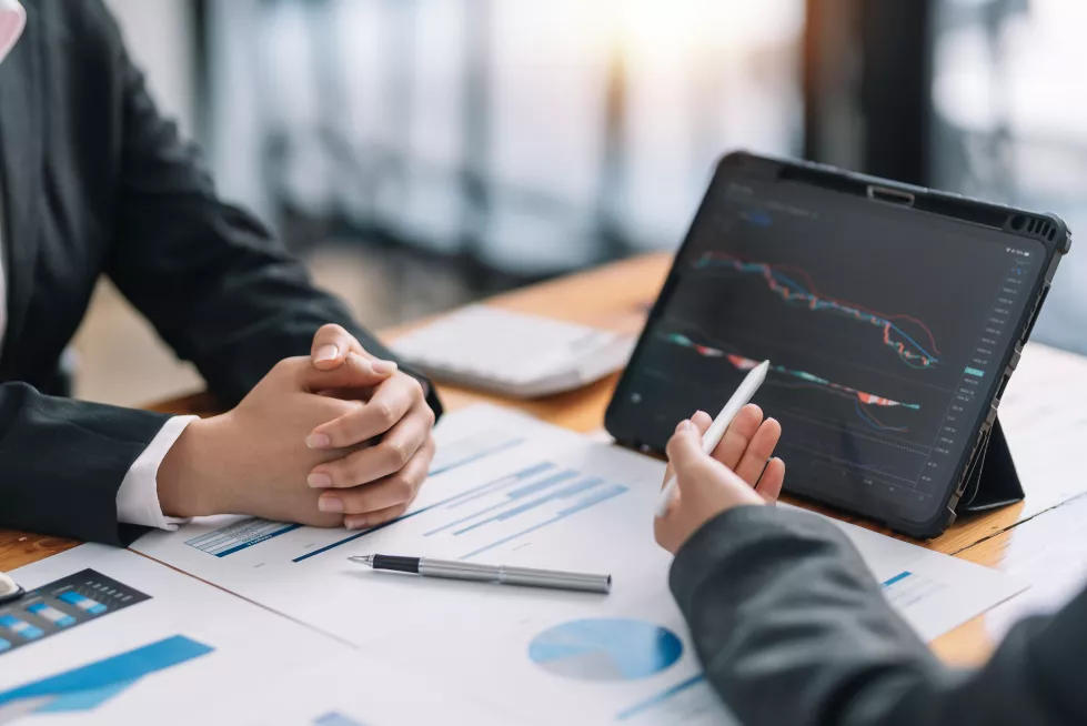 two-business-people-looking-stock-market-prices