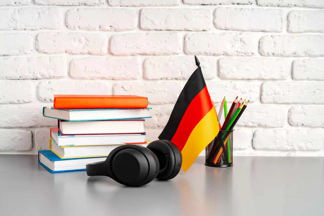 stack-books-flag-germany-desk-german-language-learning-concept(3)