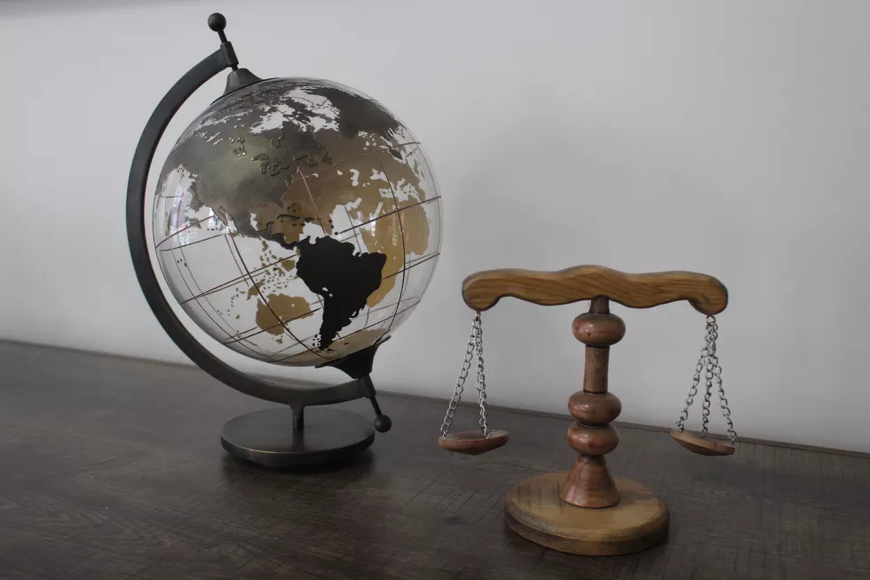 transparent-world-globe-map-wooden-scales-justice-lawyer-scales-scale-law-justice