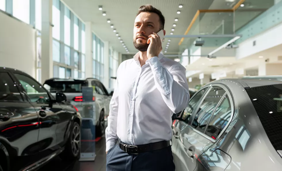 businessman-chooses-new-car-premium-car-dealership