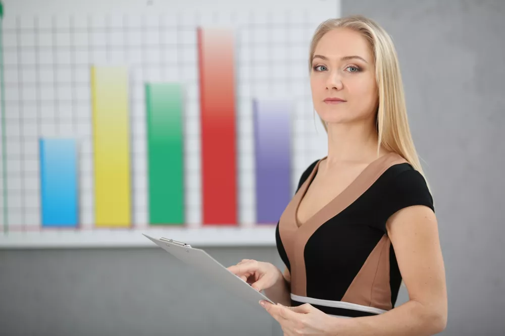 blond-business-woman-holding-folder-hands-graphics-background