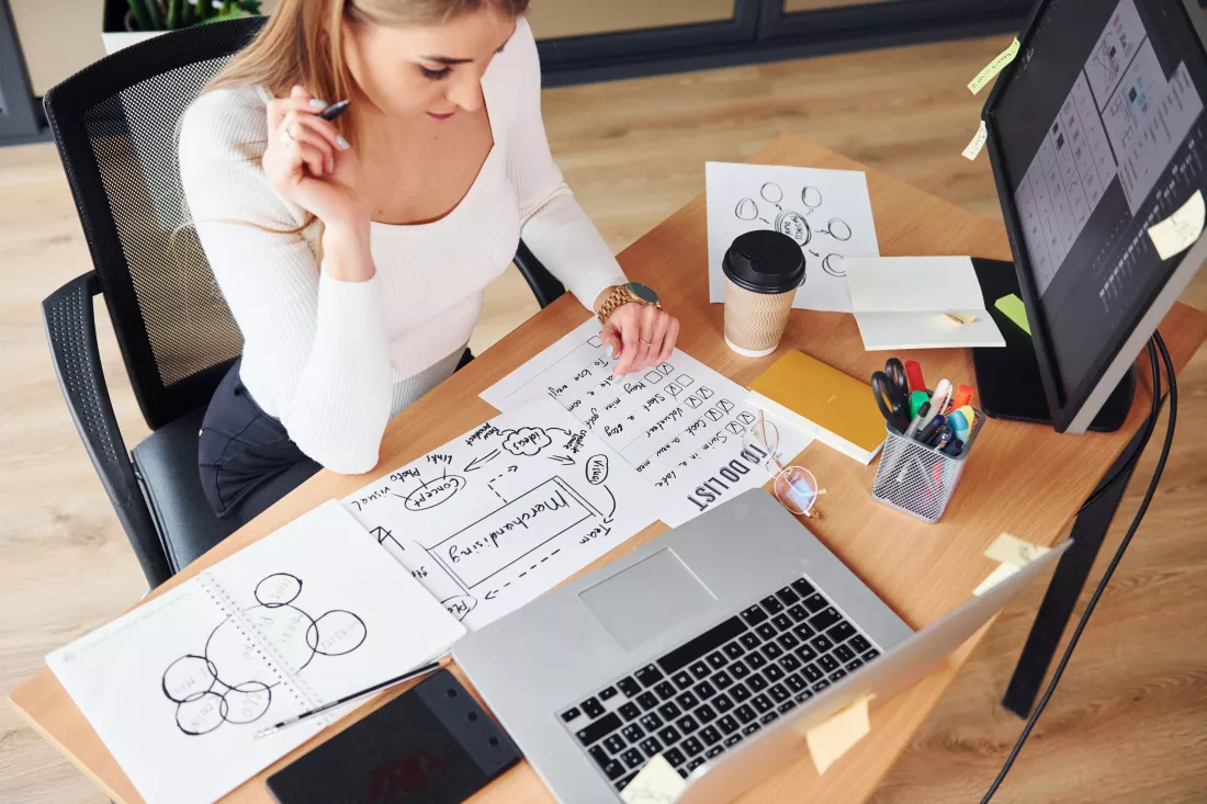 active-working-young-adult-woman-formal-clothes-is-indoors-office