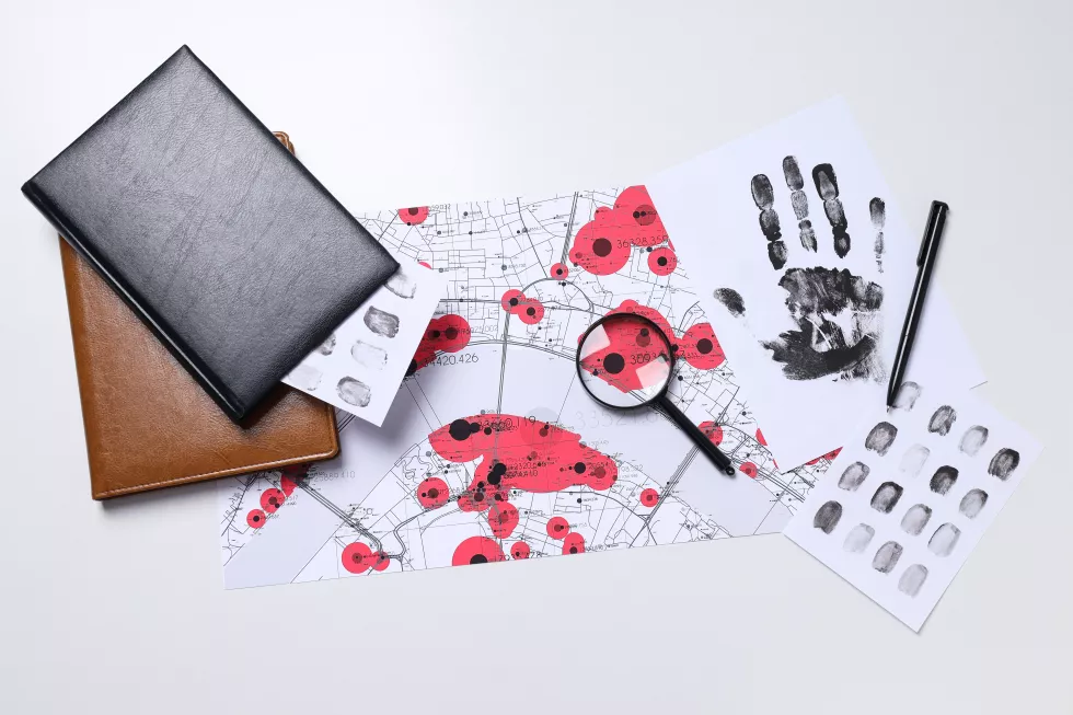 books-magnifying-glass-with-fingerprints-white-background