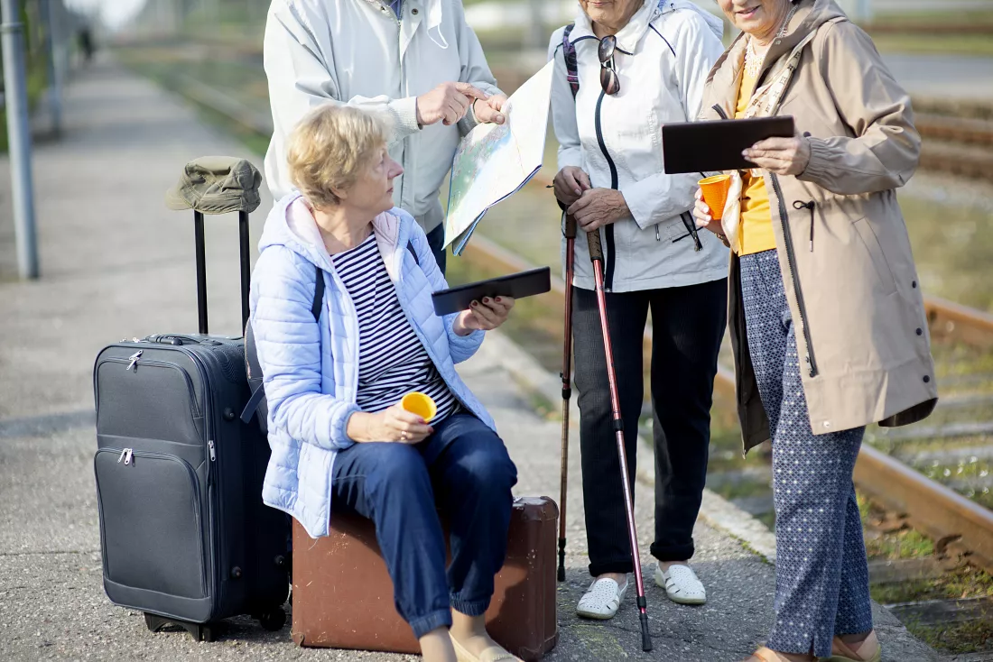 group-positive-senior-people-looking-map-traveling-journey-pandemic