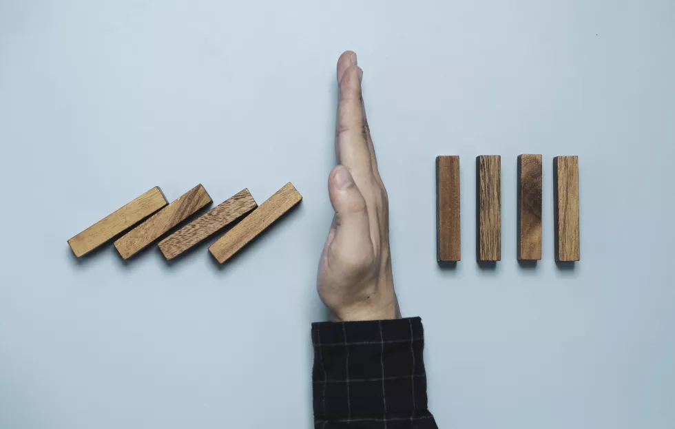directly-shot-person-holding-paper-against-white-background