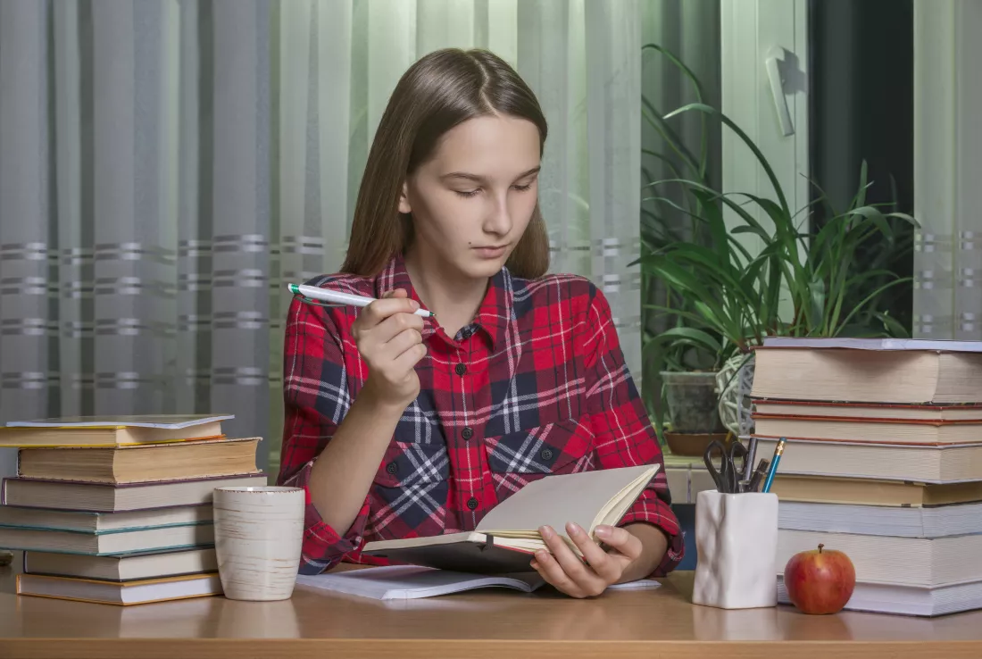 teenage-girl-is-doing-her-homework