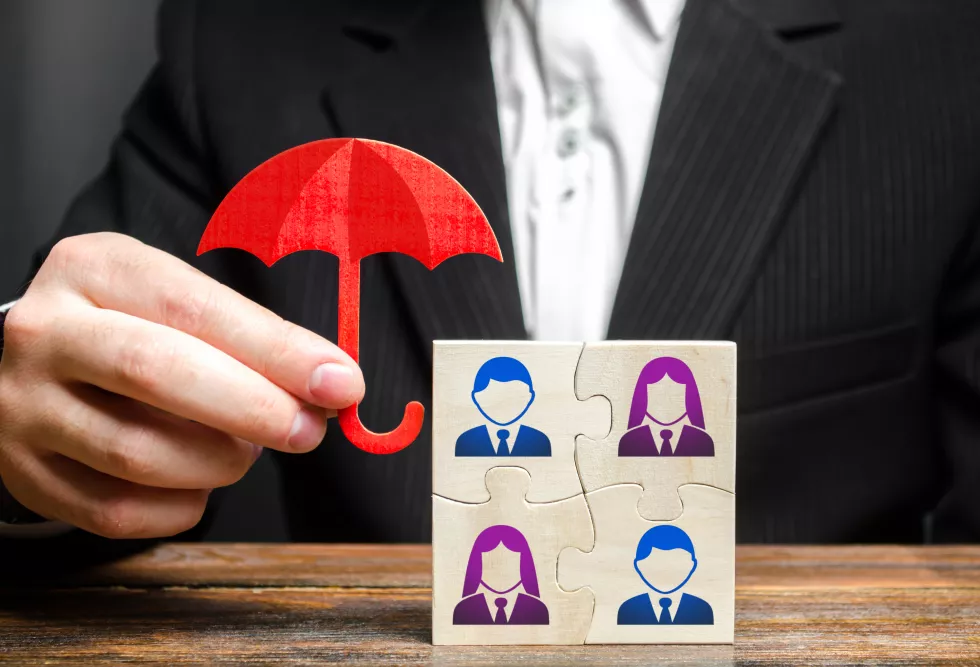 businessman-insures-protects-business-team-employees