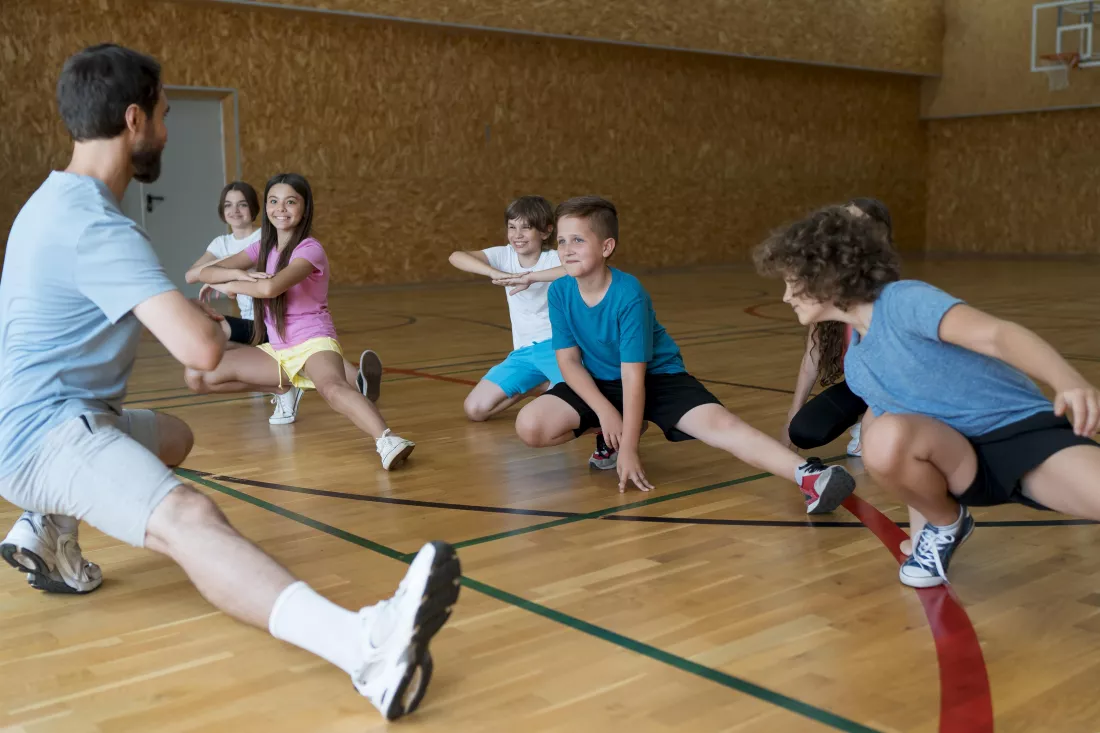 medium-shot-kids-exercising-school-gym
