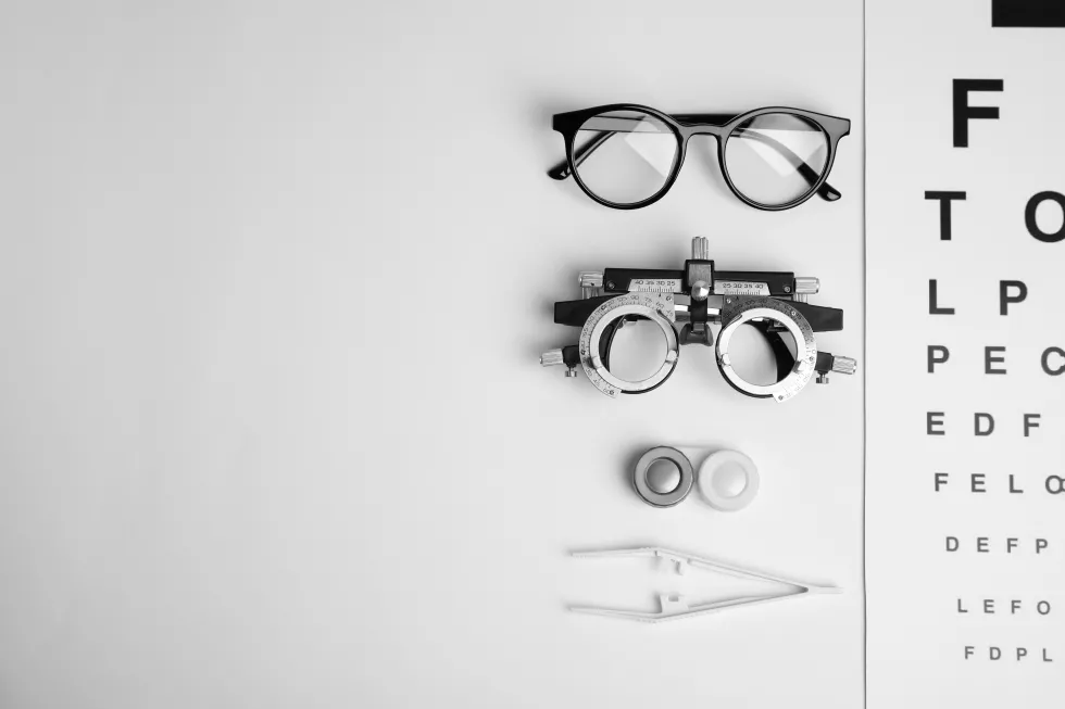 different-ophthalmologist-tools-white-background-flat-lay