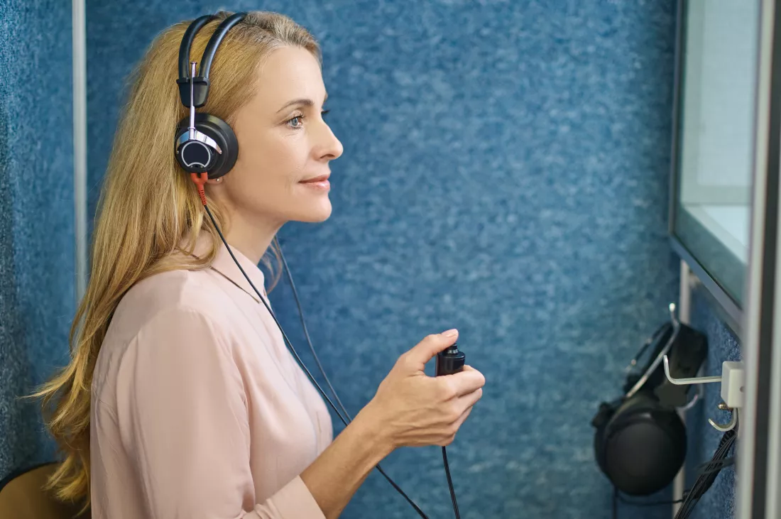 calm-female-patient-undergoing-hearing-test-clinic