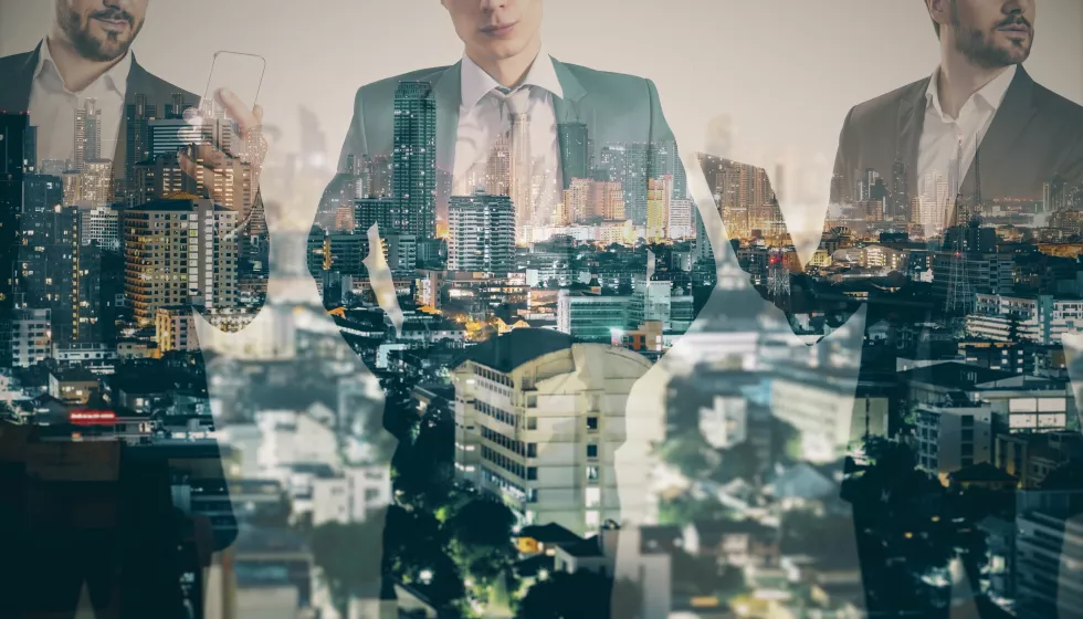 three-headless-successful-european-males-silhouettes-with-devices-standing-abstract-night-city-background-with-illumination-success-team-communication-future-concept-double-exposure