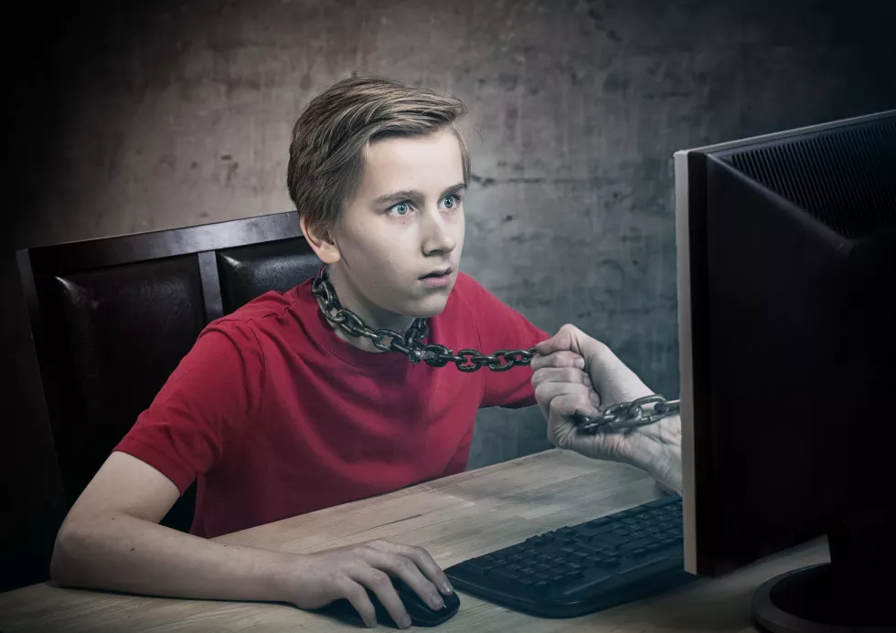 teenager-chained-his-computer-addiction-concept