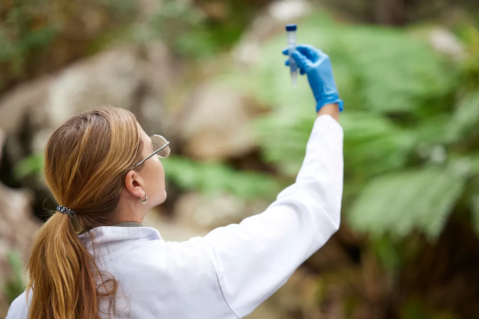science-nature-woman-with-sample-inspection-environmental-ecosystem-study-agriculture-biology-female-scientist-with-test-tube-forest-analysis-research-climate-change