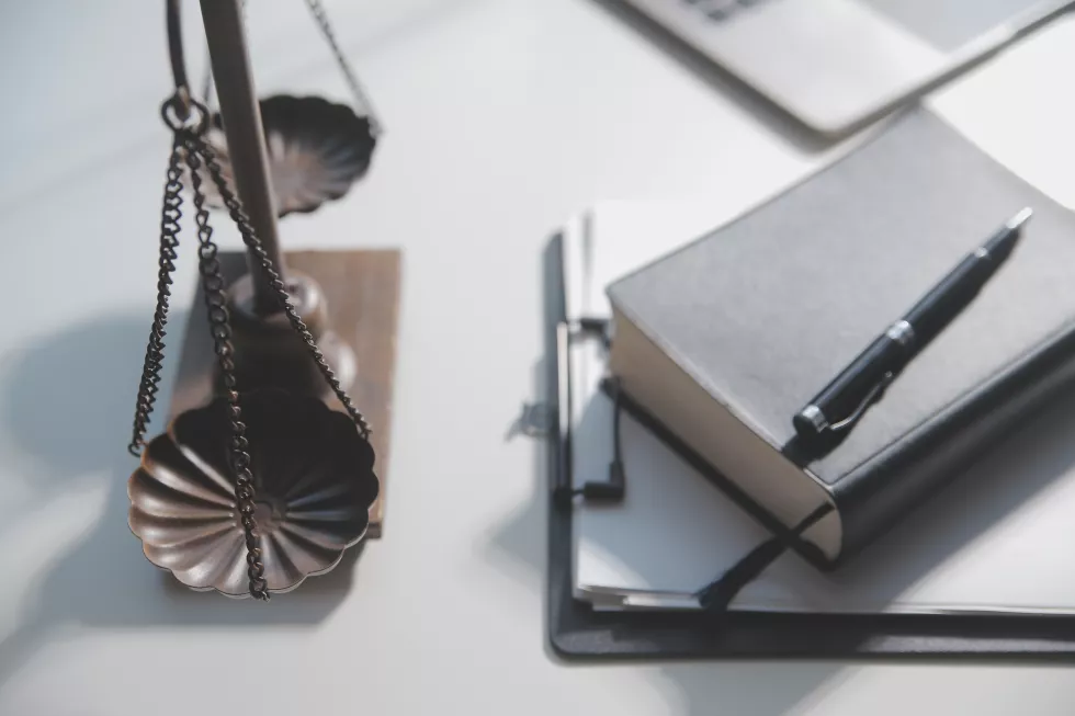 business-lawyers-discussing-contract-papers-with-brass-scale-desk-office-law-legal-services-advice-justice-law-concept-picture-with-film-grain-effect(1)