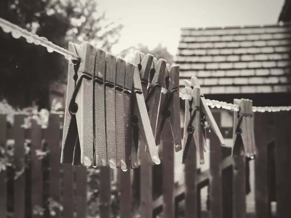 close-up-wet-clothespins-rope-rainy-season