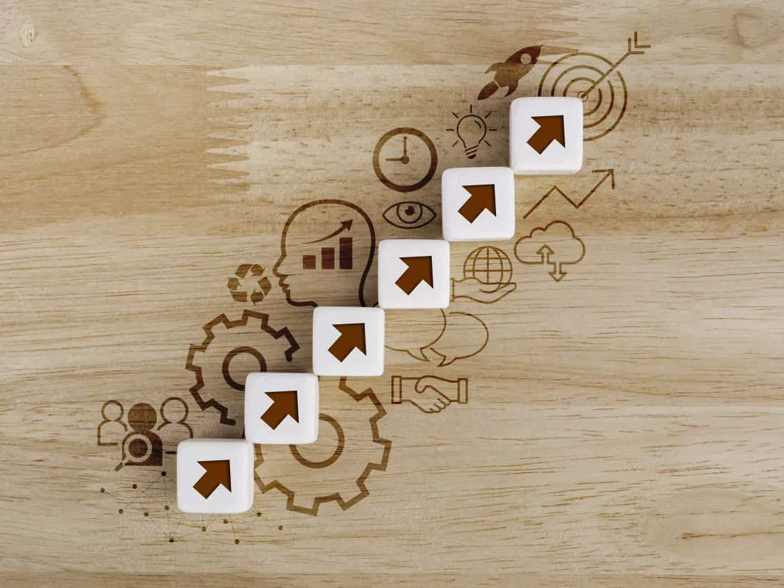 business-growth-success-process-concept-white-dice-blocks-with-arrow-icons-stacking-as-step-stairs-with-icon-business-strategy-action-plan-wood-background