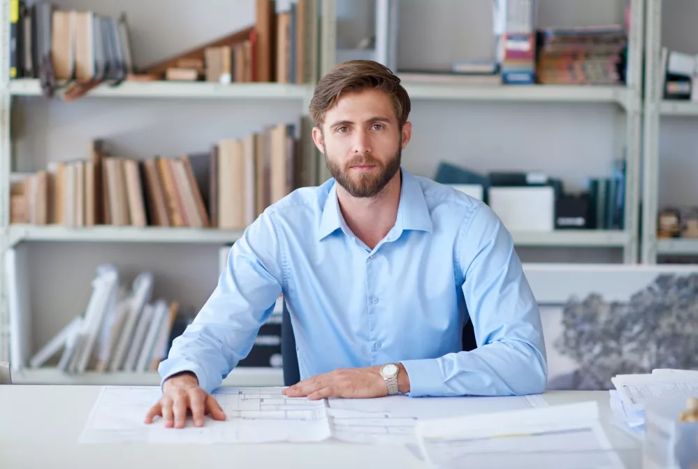 architect-portrait-man-office-with-blueprint-confidence-paperwork-project-management-design-businessman-professional-desk-creative-idea-floor-plan-business-development