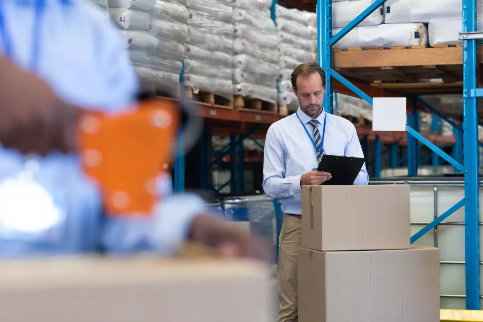male-supervisor-working-clipboard-warehouse(1)