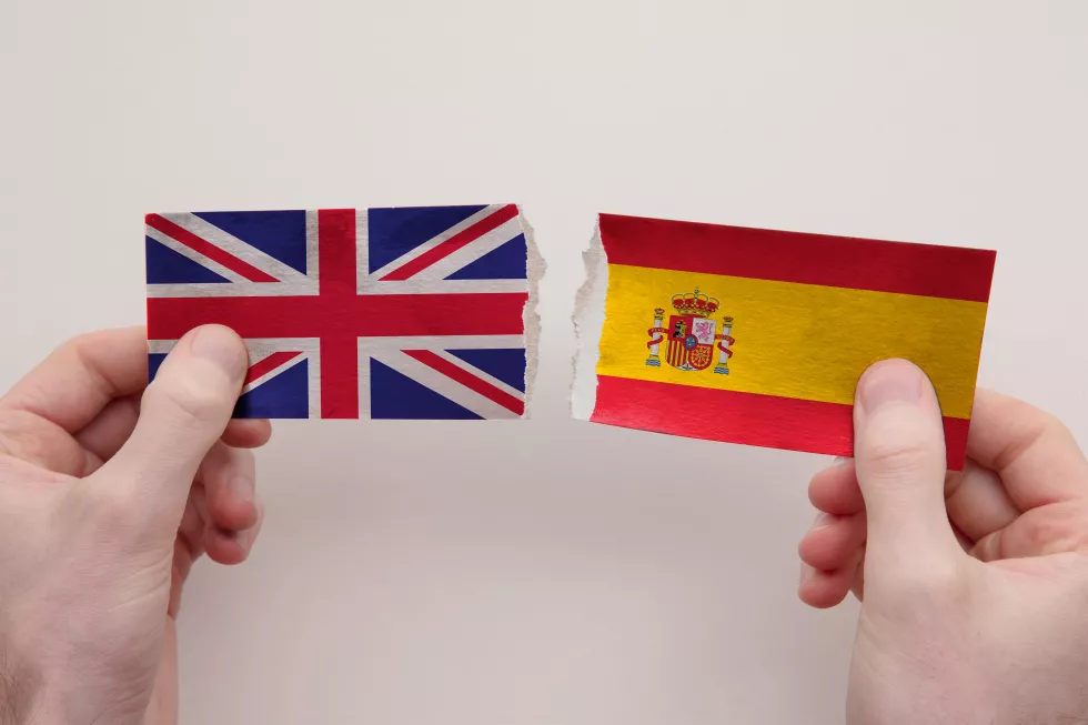 uk-spain-paper-flags-ripped-apart-political-relationship-concept
