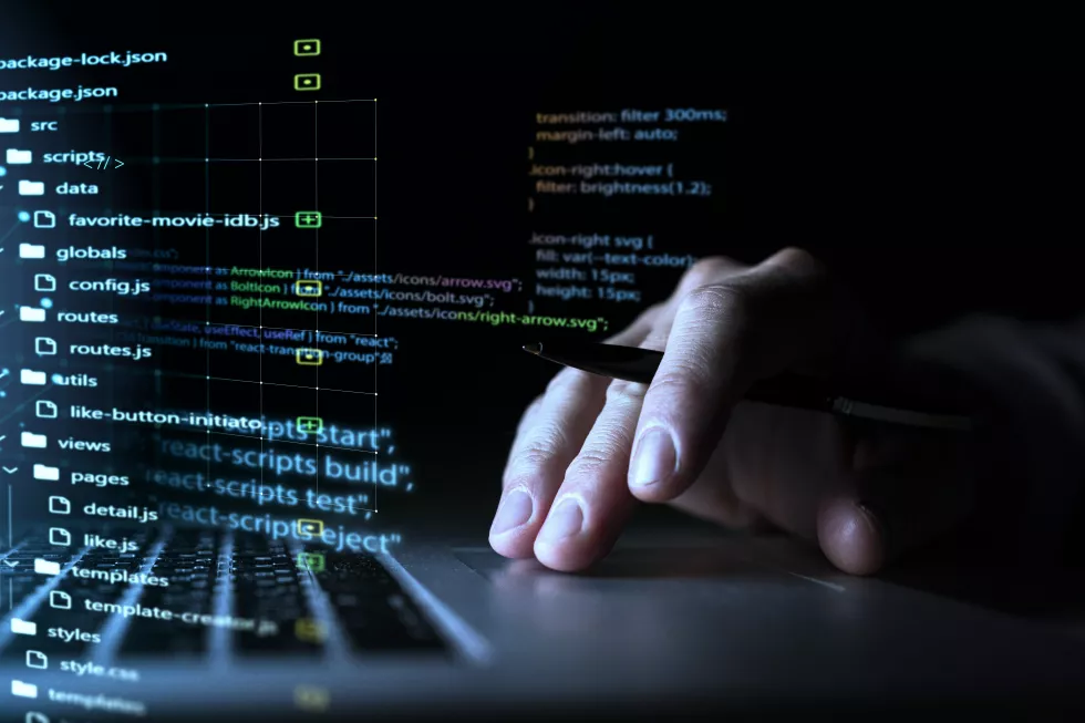 programming-background-with-person-working-with-codes-computer(1)