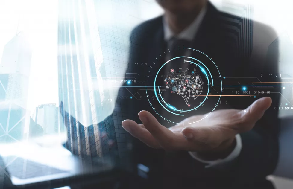 businessman-working-with-brain-representing-artificial-intelligence-virtual-screen