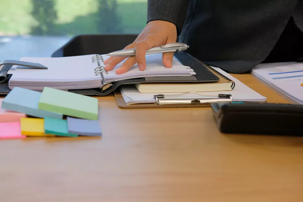 midsection-businessman-working-table