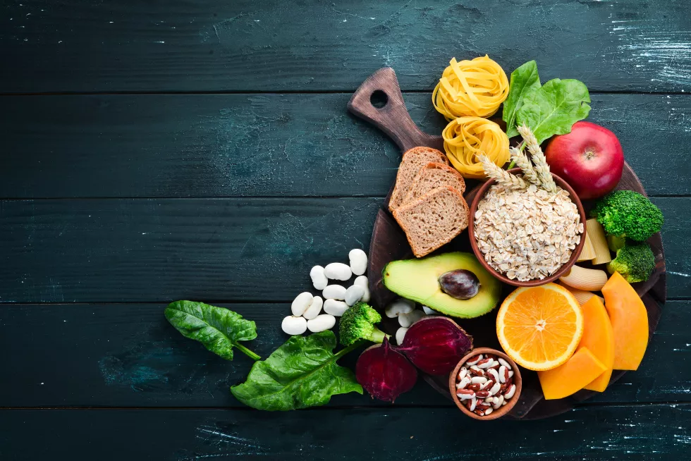 foods-high-carbohydrates-bread-pasta-avocado-flour-pumpkin-broccoli-beans-spinach-concept-healthy-eating-black-background