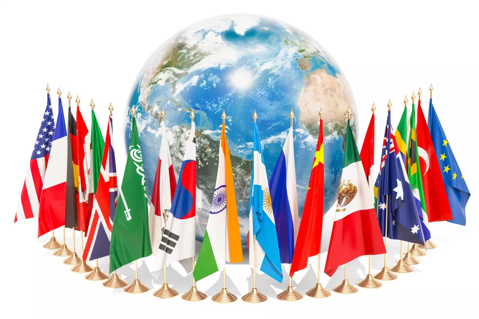 international-global-communication-concept-with-flags-around-earth-globe-3d-rendering