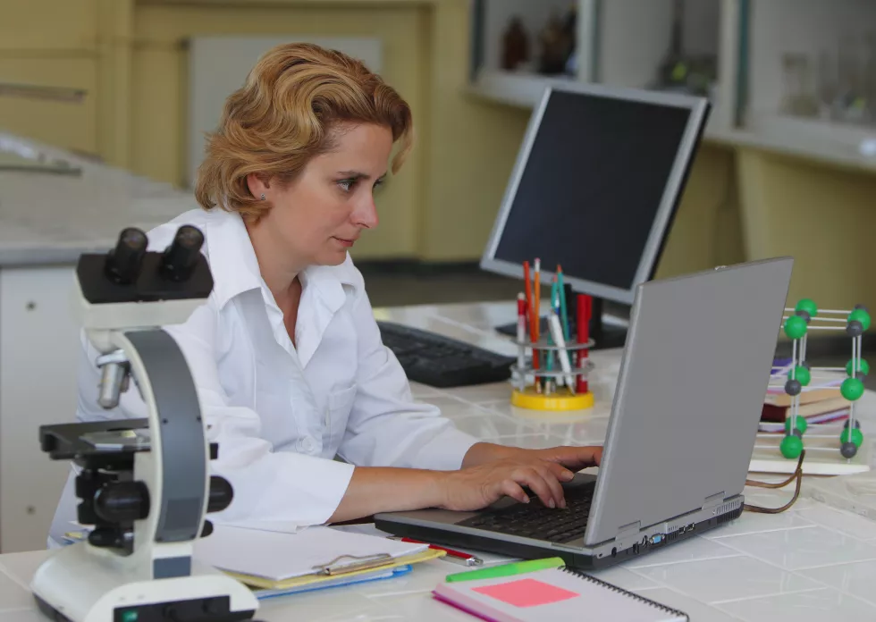 scientist-working-laptop-table(2)