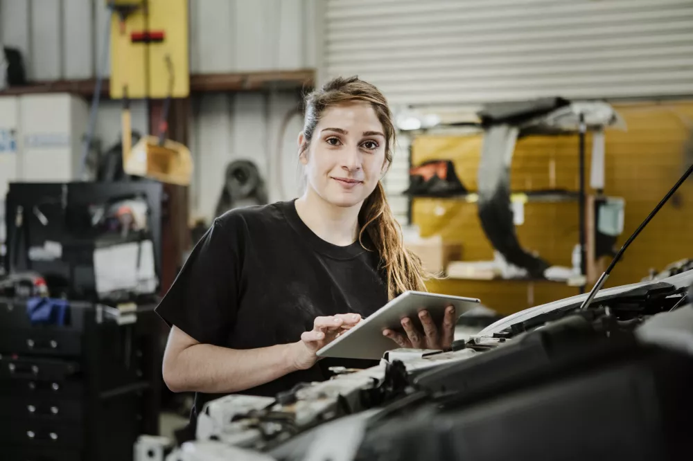 female-mechanic-running-diagnostic-car-engine