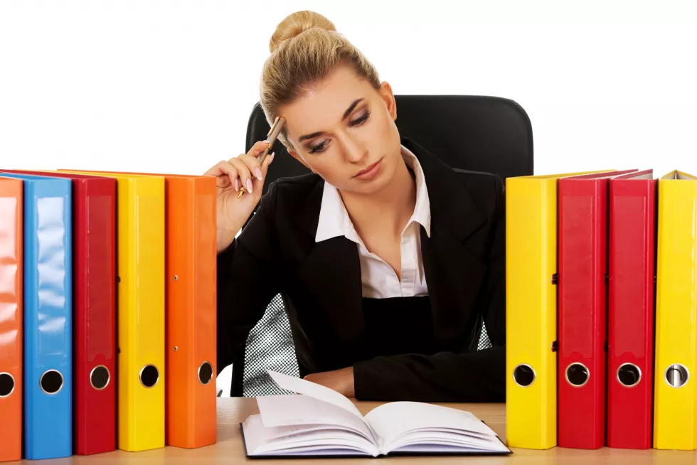 businesswoman-desk-against-white-background
