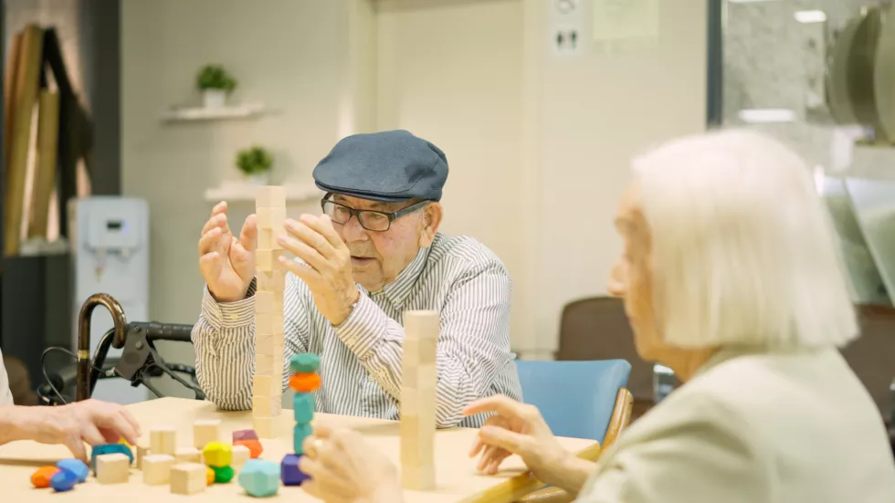 man-building-tower-as-skill-games-geriatric