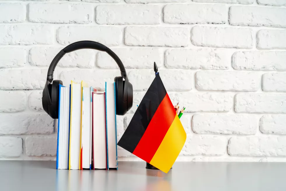 stack-books-flag-germany-desk-german-language-learning-concept