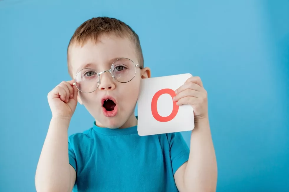 cute-little-boy-with-letter-blue-wall-child-learning-letters-alphabet